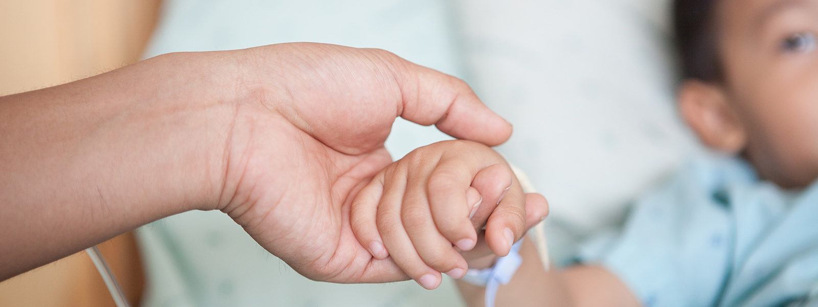 holding-child-patient-hand