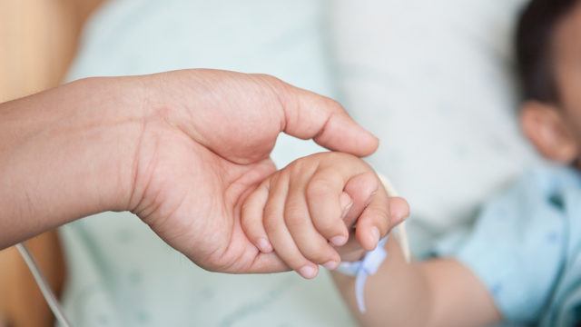 holding-child-patient-hand