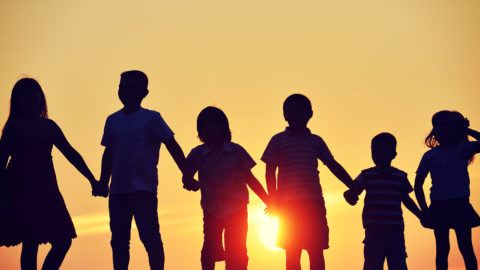kids-holding-hands-dusk